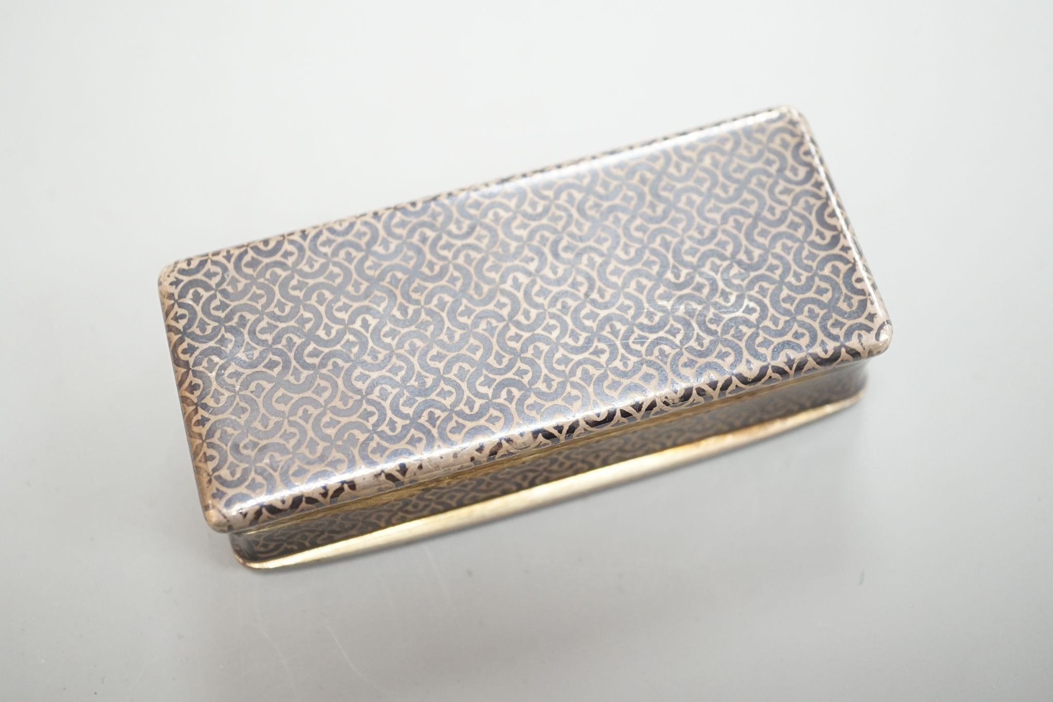 A 19th century French white metal and niello snuff box, 78mm, decorated with hunting scene.